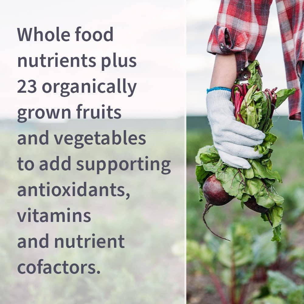 Hand holding beets, whole food nutrients plus 23 organically grown fruits and vegetables