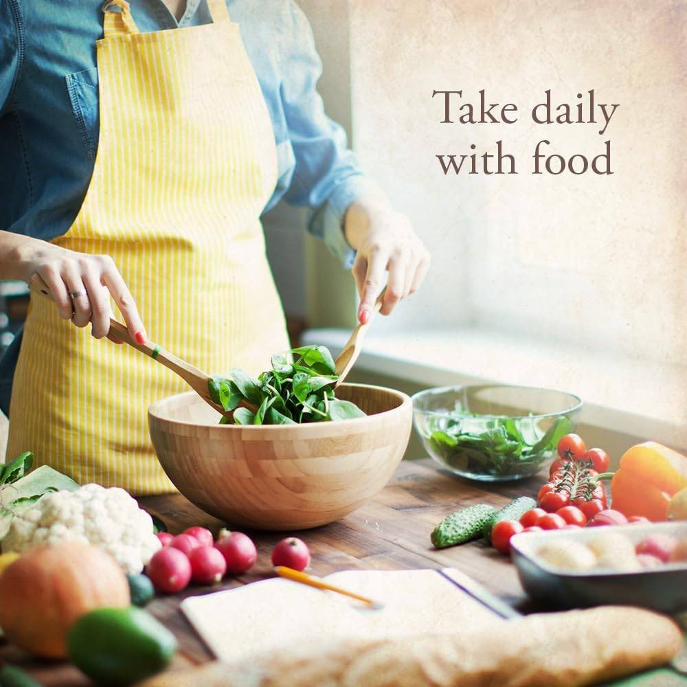 Woman tossing a salad in a kitchen, take daily with food graphic