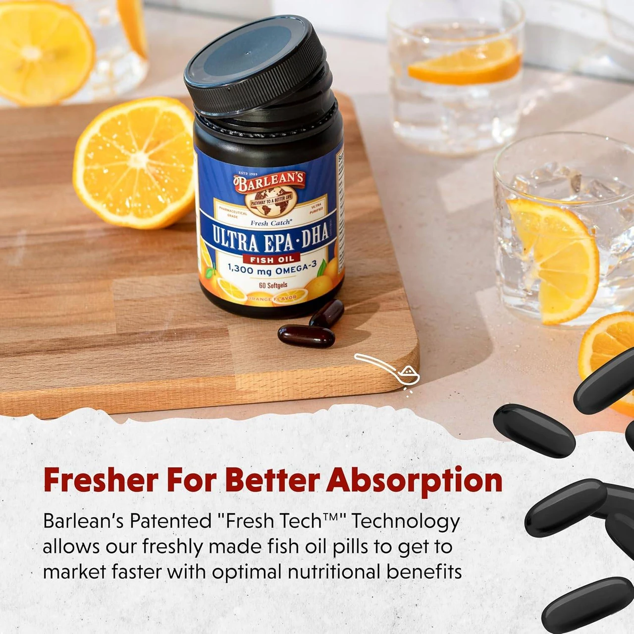 Jar on a table with orange slices and softgels, fresher for better absorption