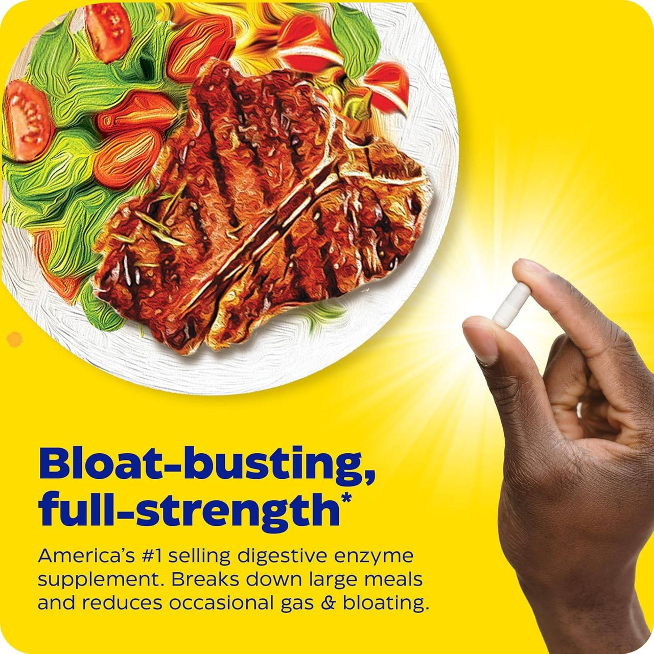 Hand holding a capsule over a steak and vegetable meal
