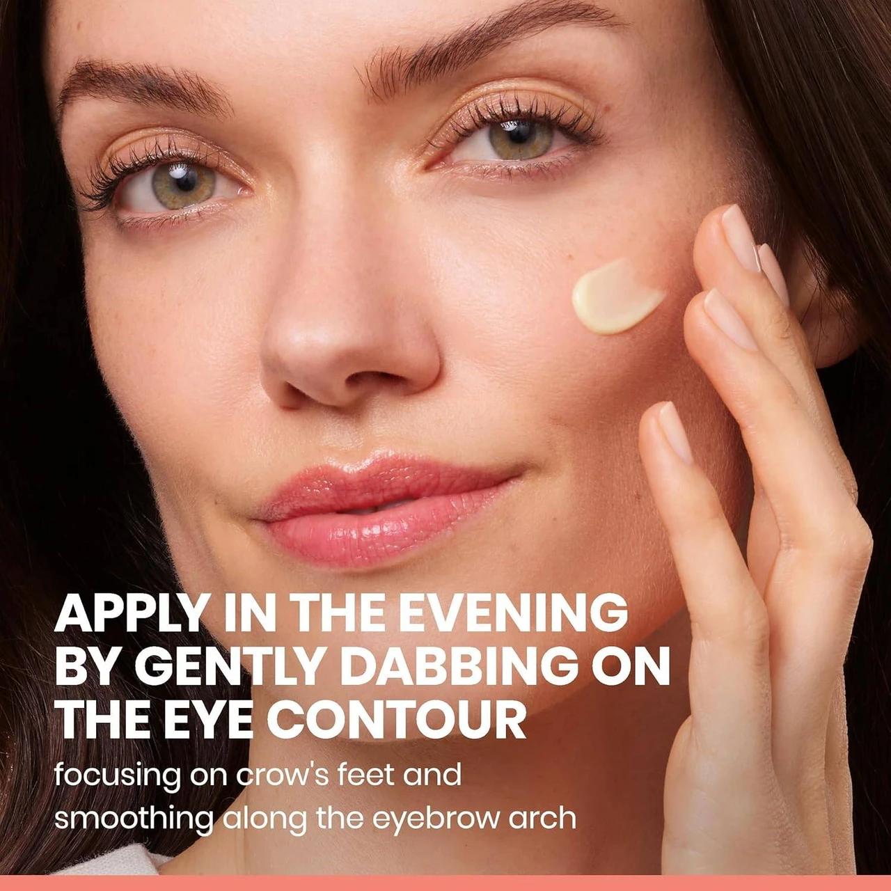 Woman dabbing eye cream near her eye with application tip
