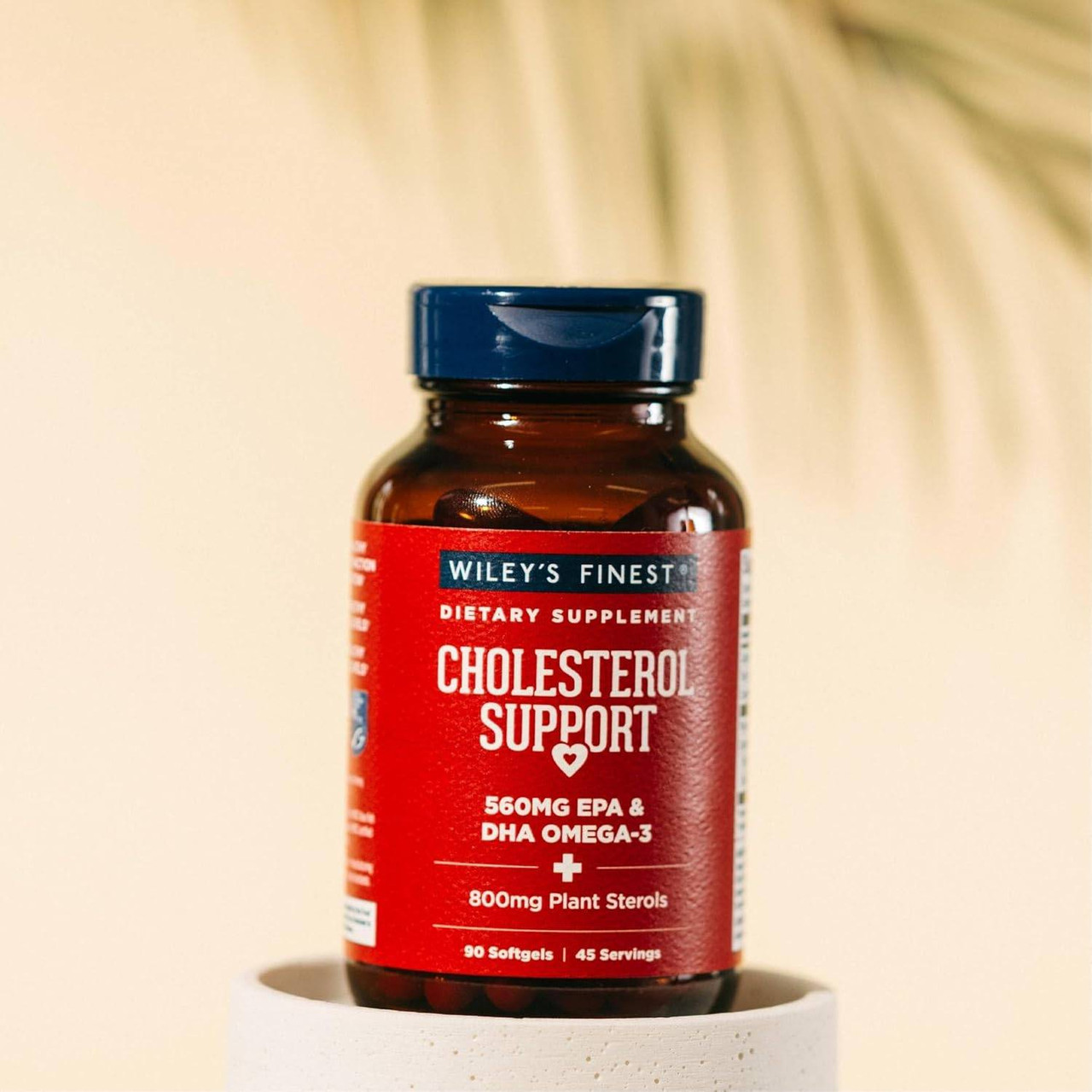 Cholesterol Support bottle on a pedestal in soft light