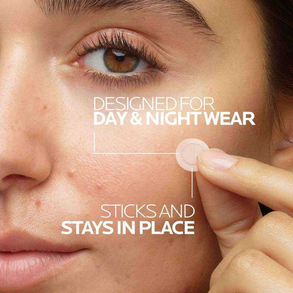 Woman applying a clear patch to her cheek, designed for day and night wear