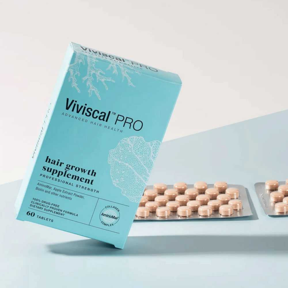 Viviscal PRO box tilted beside blister packs of tablets