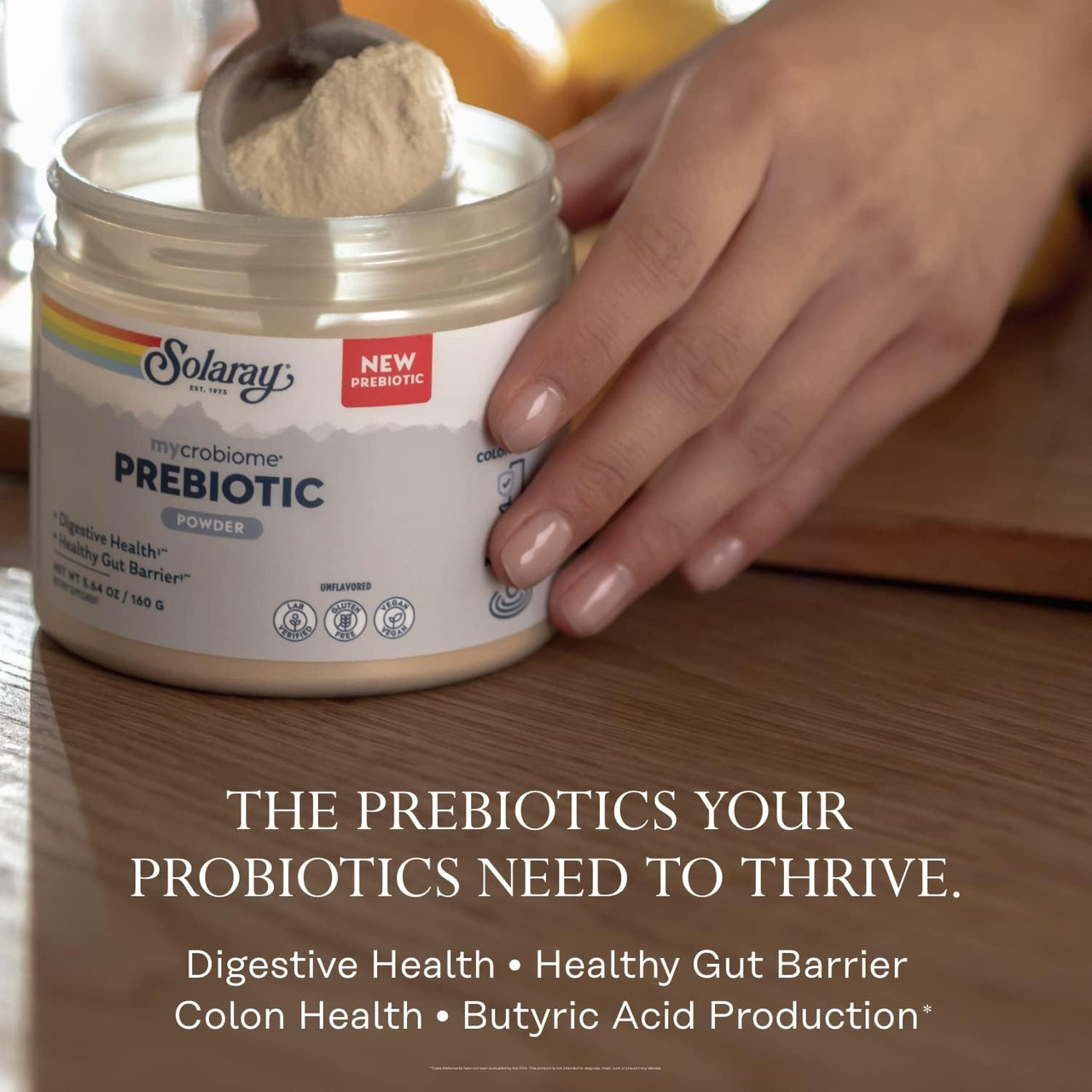 Hand scooping prebiotic powder, prebiotics your probiotics need to thrive graphic