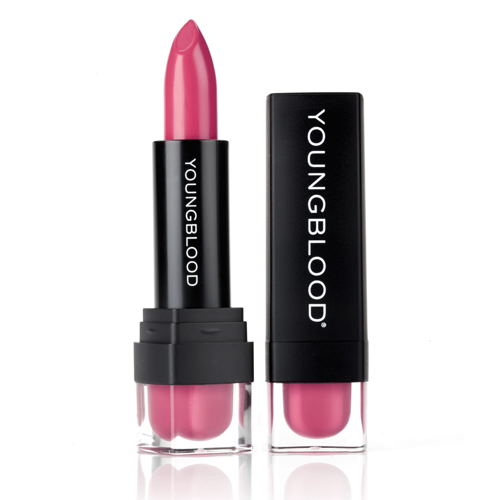 Youngblood Lipstick in a bright pink shade beside its black cap