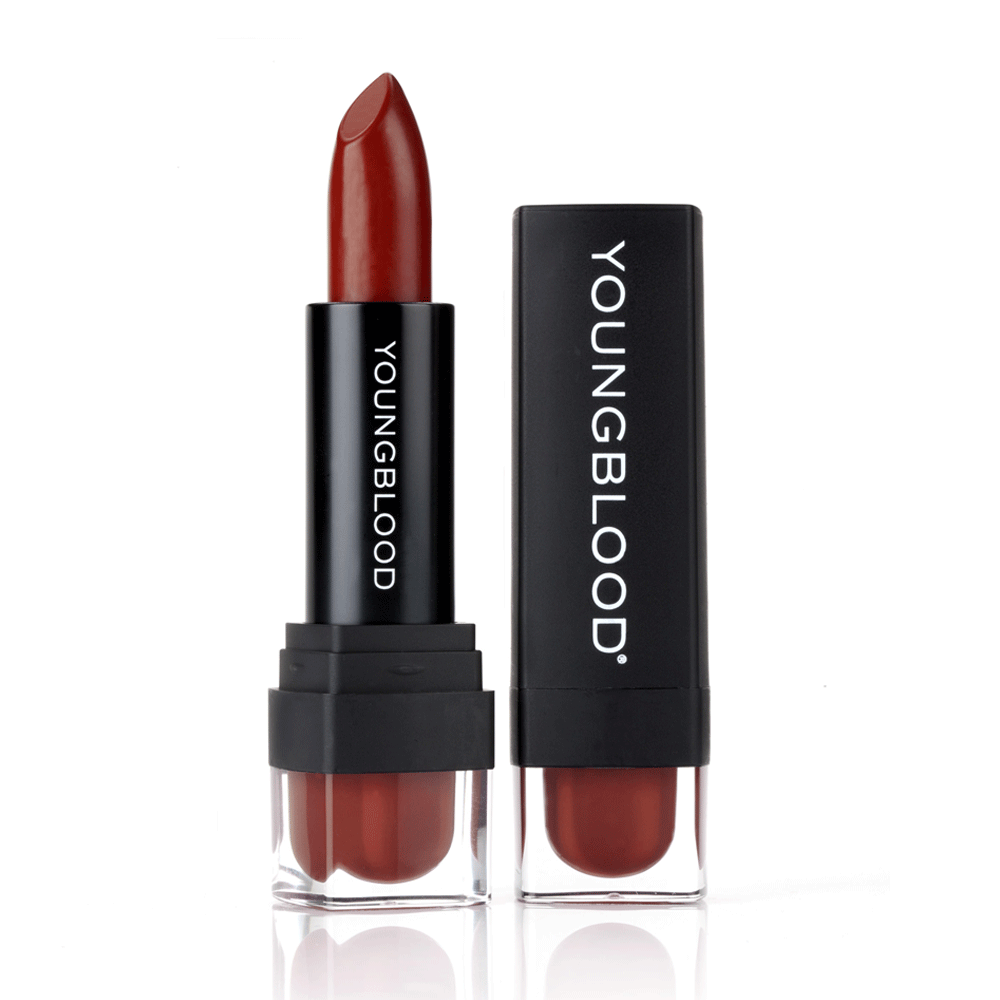 Youngblood Lipstick in a brick red shade beside its black cap