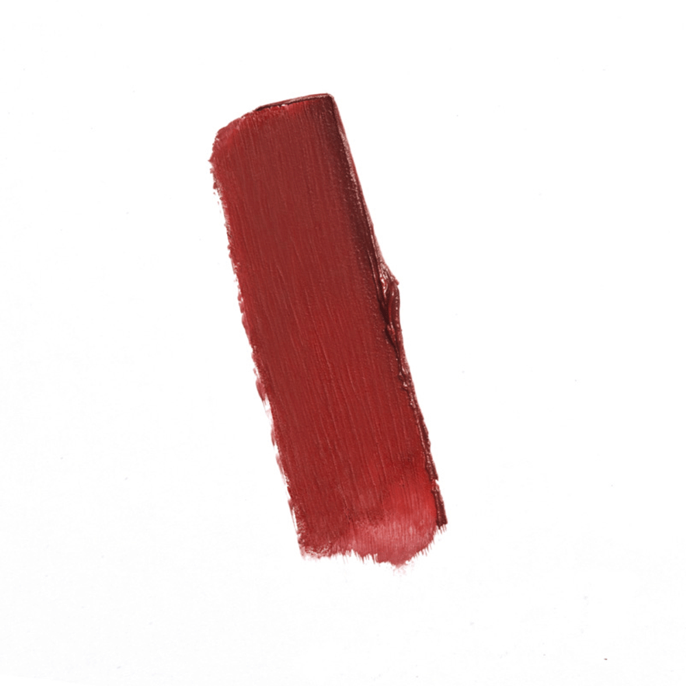 Swatch of brick red Youngblood Lipstick