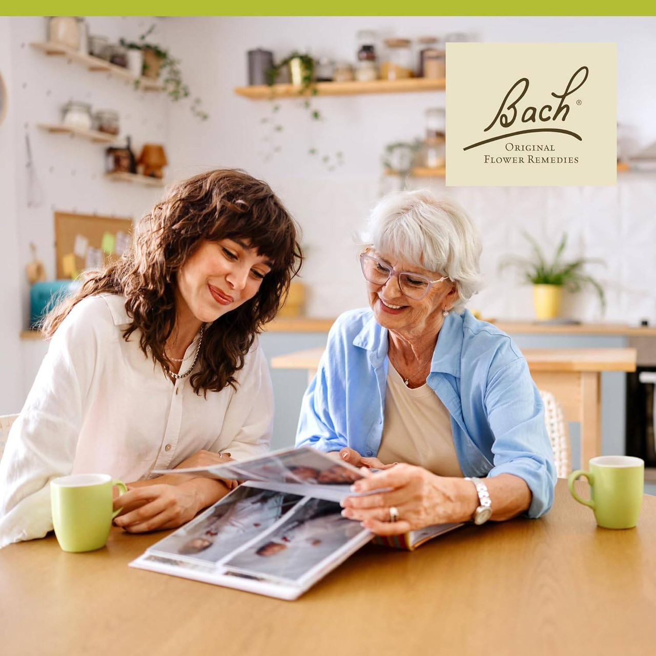 Younger and older woman looking at photo album, Bach lifestyle graphic