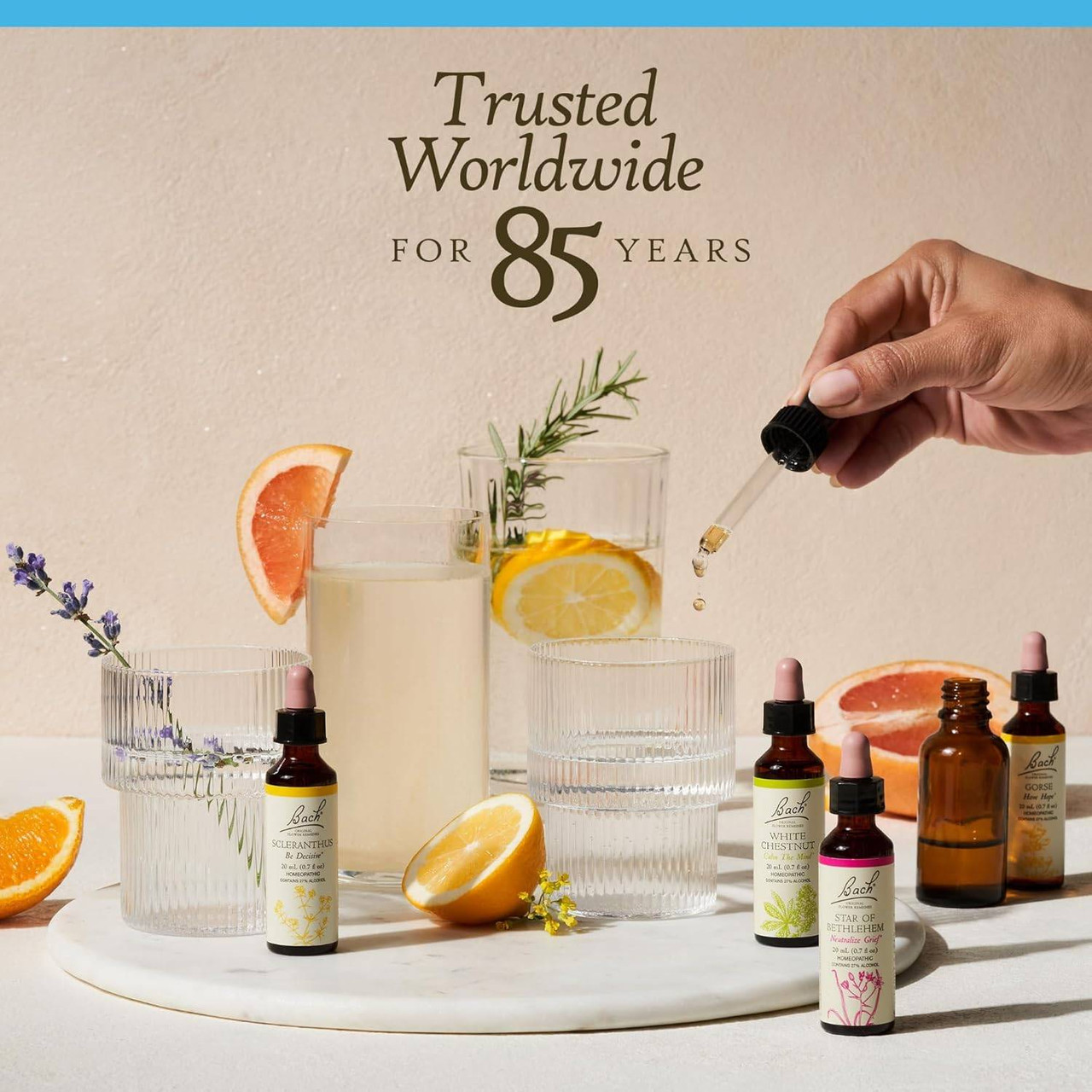 Bach bottles with citrus drinks and a dropper, trusted worldwide for 85 years graphic