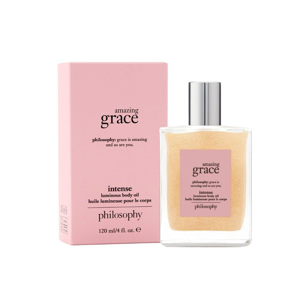amazing grace intense luminous body oil bottle beside pink box