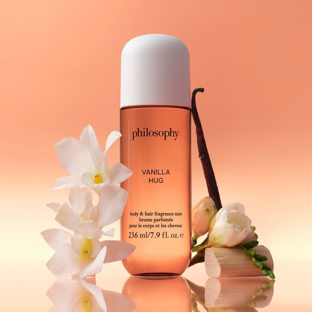 Vanilla Hug fragrance mist with vanilla pods and white flowers
