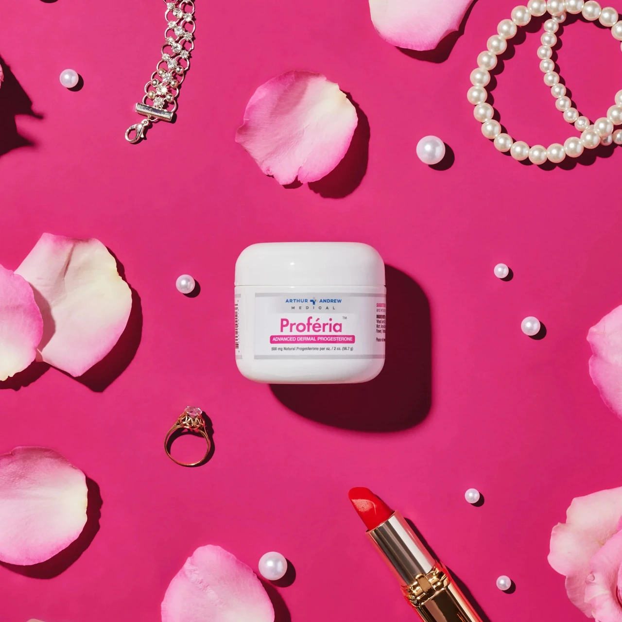 Proferia tub with rose petals jewelry lipstick lifestyle graphic