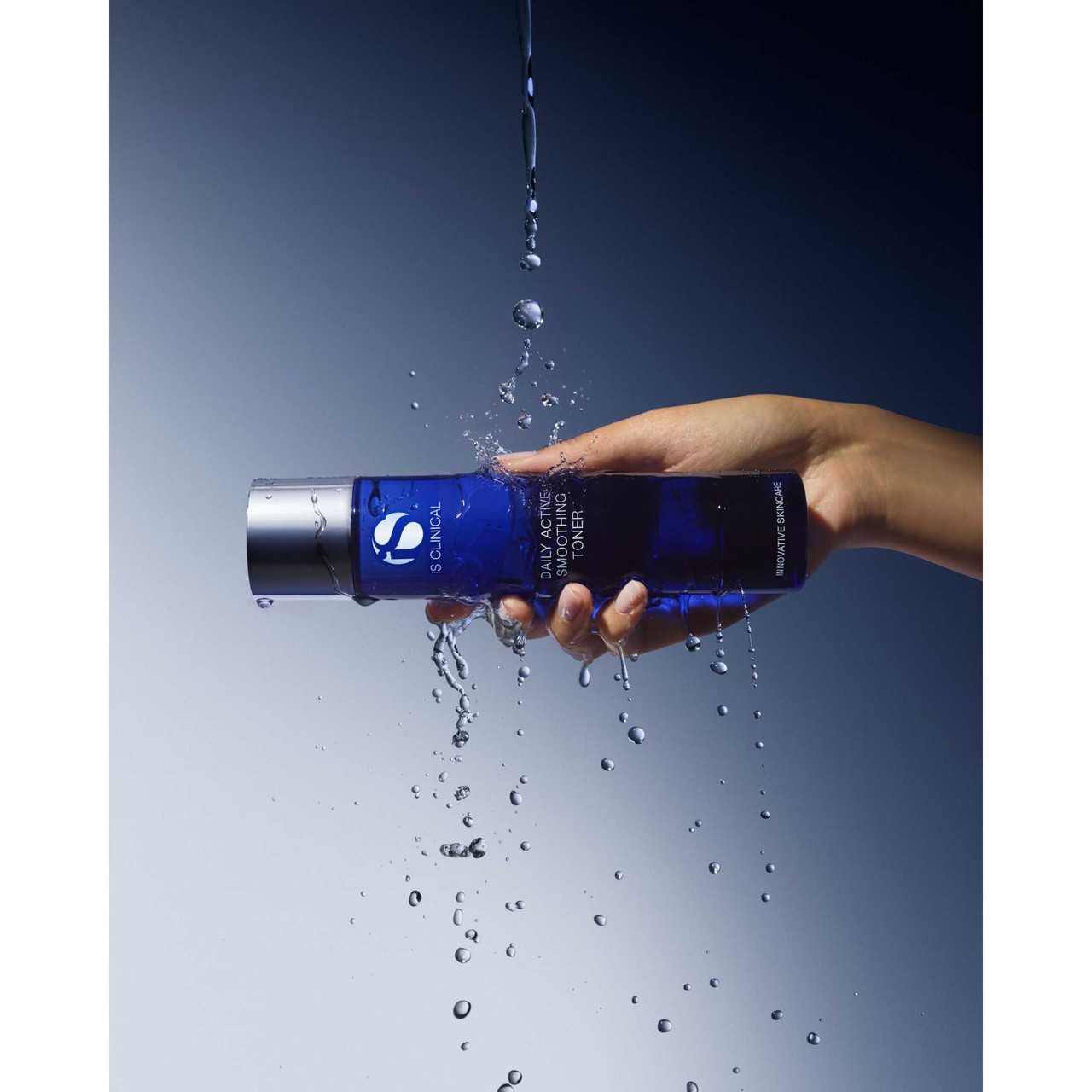 Hand holding Daily Active Smoothing Toner horizontal with water splash