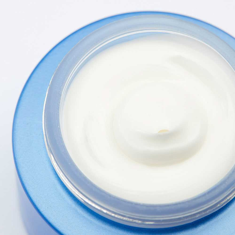 Open jar of rich white night cream