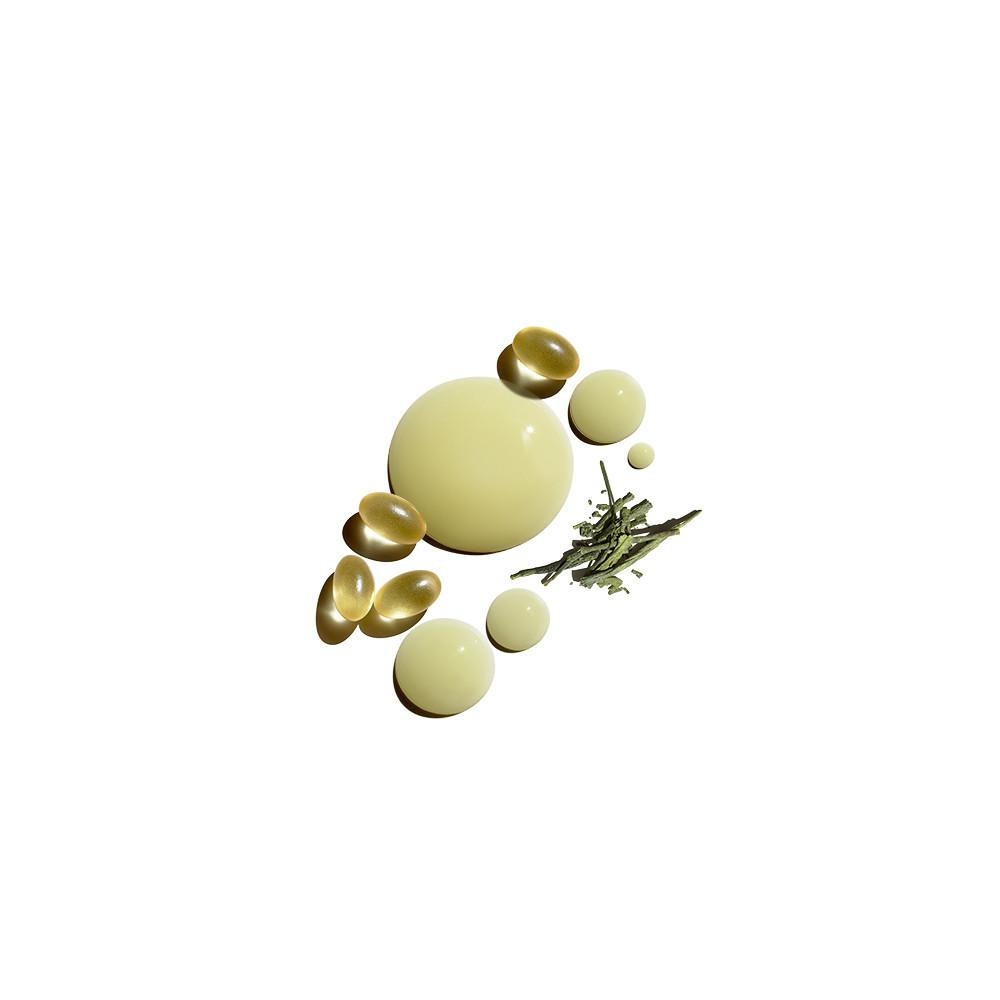Golden serum drops and beads with a sprig of herbs