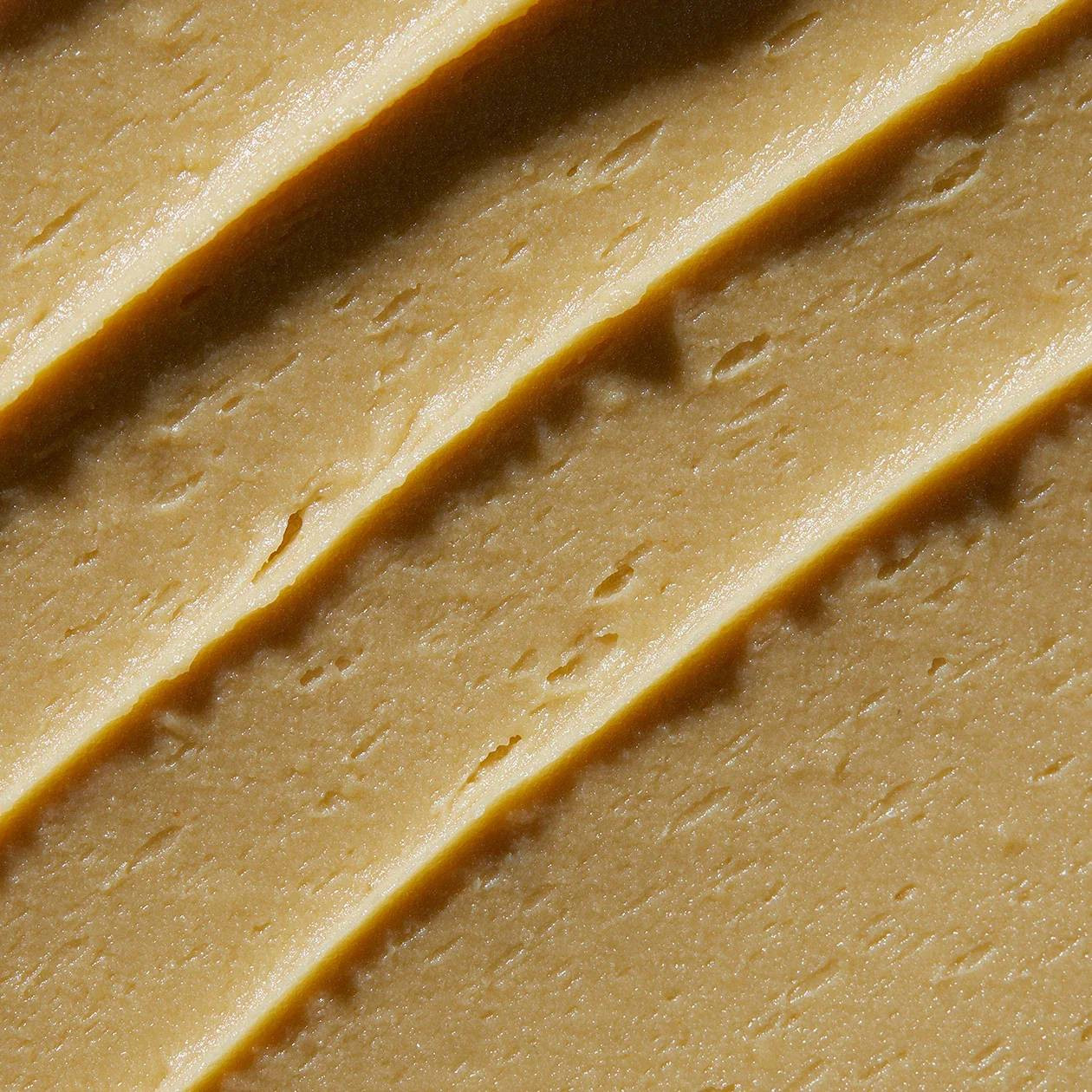 Close-up of grainy golden scrub texture
