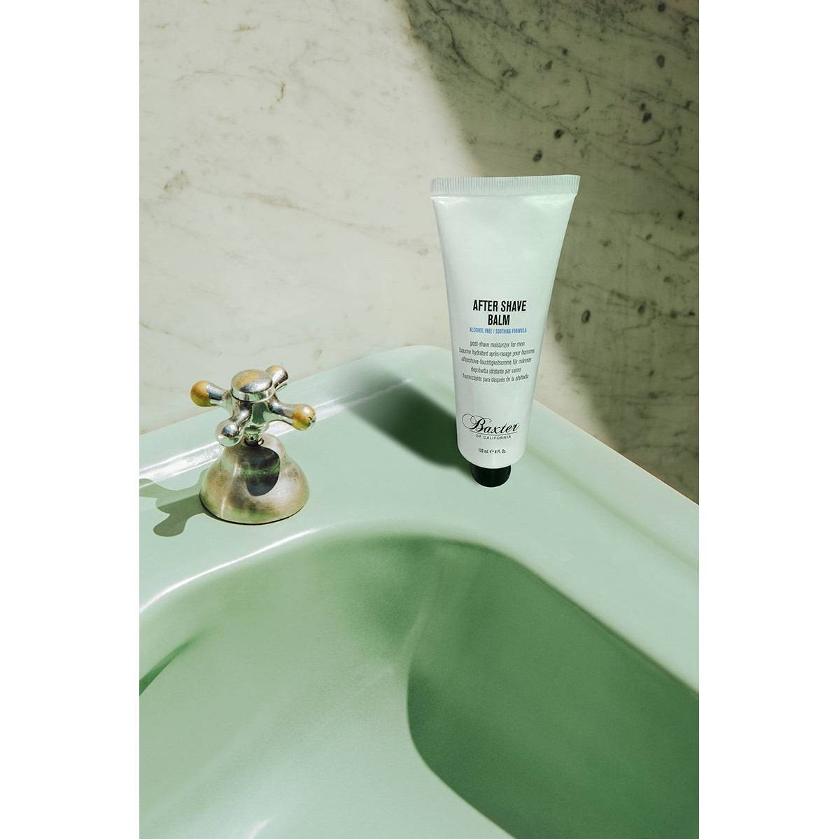 Baxter of California After Shave Balm on a mint green sink