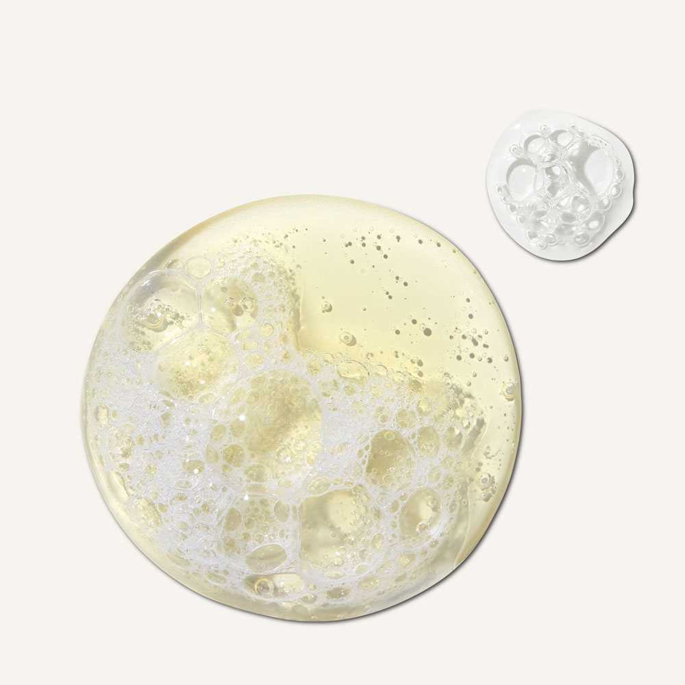 Pool of golden cleanser with bubbles