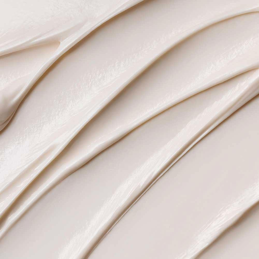 Close-up of creamy off-white Stabilizing Repair Cream texture