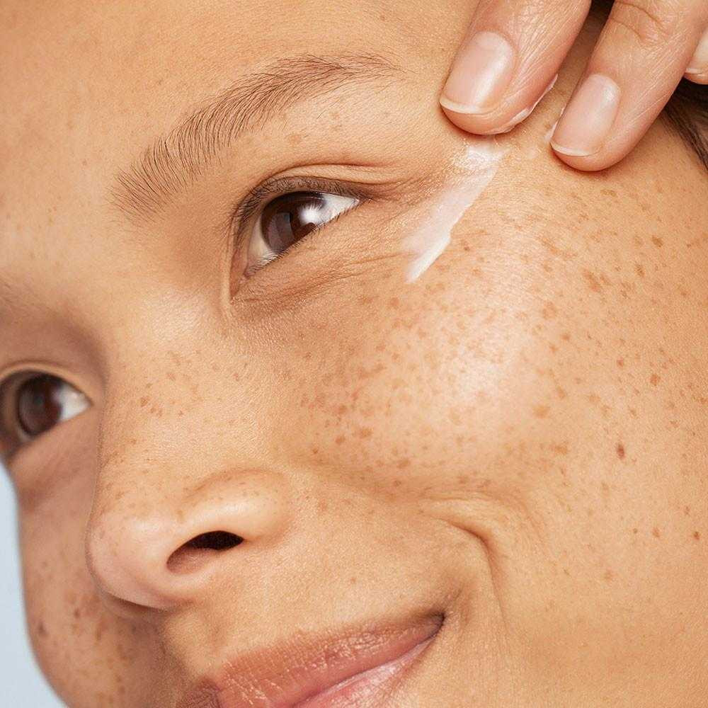 Model applying Dermalogica Phyto Nature Lifting Eye Cream near eye