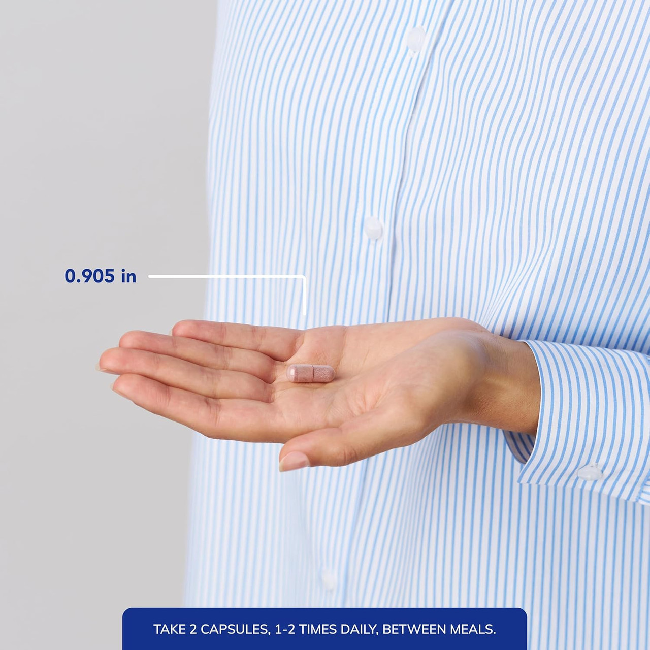 Open hand with capsule size marker and take 2 capsules text