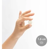 Hand holding a 1.6 cm chewable tablet for size
