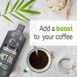 MCT Oil bottle beside a cup of coffee, add a boost to your coffee