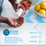 Hand holding tablets beside fruit, Klean is clean graphic, GMO-free, no wheat, gluten or artificial additives