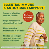 Smiling woman, essential immune and antioxidant support with 400 mg vitamin C
