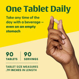 Hand holding tablet, one tablet daily, 90 tablets, 90 servings