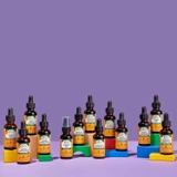 Row of Herb Pharm liquid extract bottles on colorful pedestals