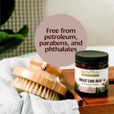 Balm jar beside a dry brush, free from petroleum, parabens and phthalates