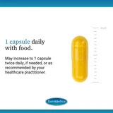 Single yellow capsule beside a ruler, 1 capsule daily with food