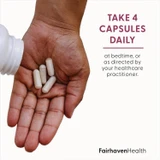 Hand holding capsules, take 4 capsules daily at bedtime graphic