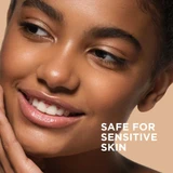 Smiling model touching cheek with safe for sensitive skin text