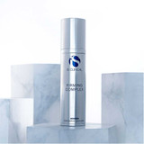 iS Clinical Firming Complex bottle on white marble blocks