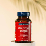Cholesterol Support bottle on a pedestal in soft light