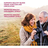 Smiling older couple with binoculars beside heart health support text