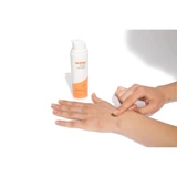 Hand applying serum to the back of another hand