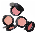 Four open Youngblood Pressed Mineral Blush compacts in pink and coral shades