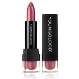 Youngblood Lipstick in a rose coral shade beside its black cap