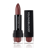 Youngblood Lipstick in a burgundy brown shade beside its black cap
