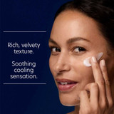 Woman applying cream to her cheekbone with texture text