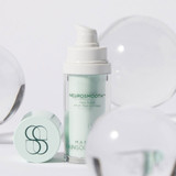 Serum bottle with a cap and glass spheres