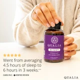 Woman holding a Qualia Night bottle with a five star customer review