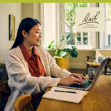 Woman working intently at laptop, Bach Original Flower Remedies lifestyle graphic