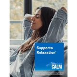 Woman relaxing on a sofa beside a CALM box, supports relaxation graphic