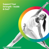 Woman in a yoga side-angle pose on a green background