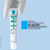 Gloved hand holding the Effaclar BPO tube, dermatologist recommended brand graphic